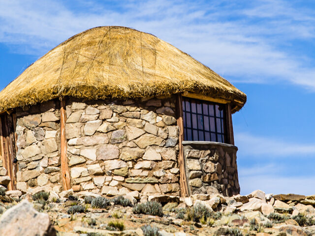 Historical sites as well as dry stone walls and houses dot the shores of Lake Titicaca.